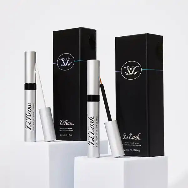 LiLash and LiBrow serums with sleek silver applicators and black packaging for lash and brow enhancement