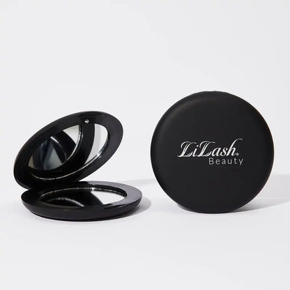 Black round compact mirror with Lilash Beauty logo, shown open and closed on white background