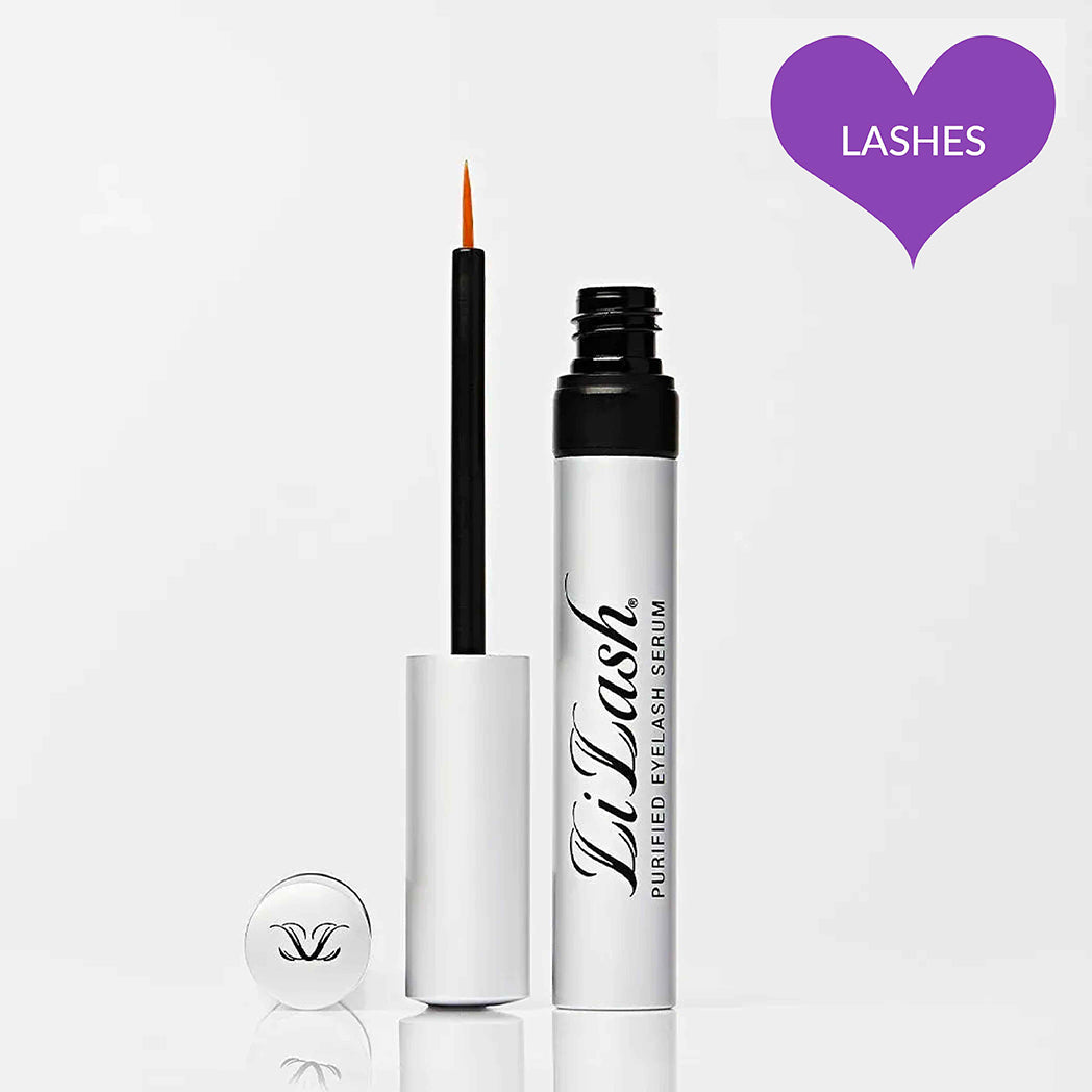 Eyelash serum tube with brush applicator on white background, purple heart with &